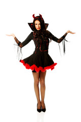 Woman in devil clothes with open hands gesture 