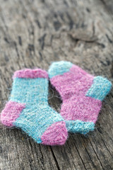 Fototapeta na wymiar Two small woolen socks