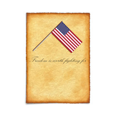 United States Independence Day. USA flag lying on the sheet of parchment. Symbol of freedom.