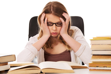 Young woman with a books pile