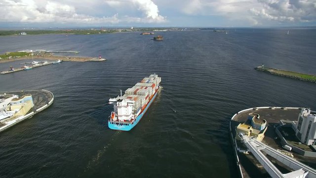 Aerial view of container ship sails to port