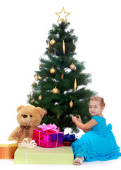 elegant girl near the Christmas tree