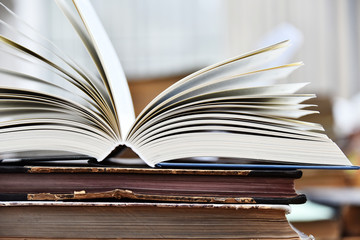 Hardcover book lying on the table in a library