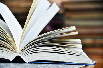 Hardcover book lying on the table in a library