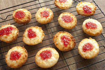 Coconut cookies with strawberry jelly