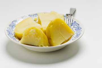 Boiled potatoes in the plate on white background
