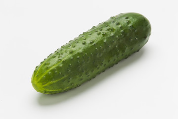 Green cucumbers on a white background