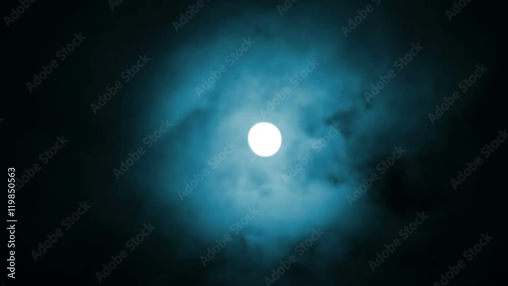 Wall mural night view at the moon through blue moving clouds