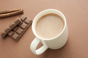 Mug of delicious hot chocolate with ingredients