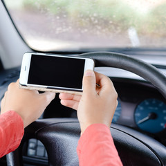 Hand hold use phone in car closeup