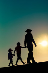 Fototapeta na wymiar Summer sunset with happy family on outdoors background