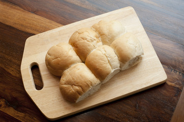 Six crusty white rolls