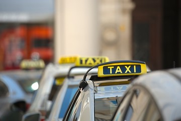 Taxis on a street - obrazy, fototapety, plakaty