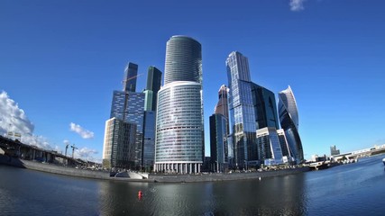 Clouds floating over skyscrapers of Moscow International Business Center (Moscow-City),  Bagration Bridge and Third Ring Road. Fisheye. Time-lapse. UHD - 4K. August 31, 2016. Moscow. Russia