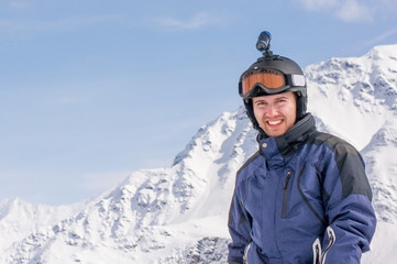 Fototapeta na wymiar A Man On A Background Of Snowy Peaks