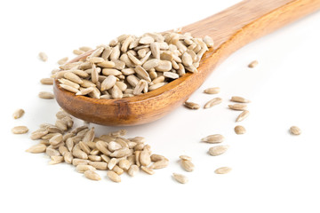 Shelled sunflower seeds in wooden spoon