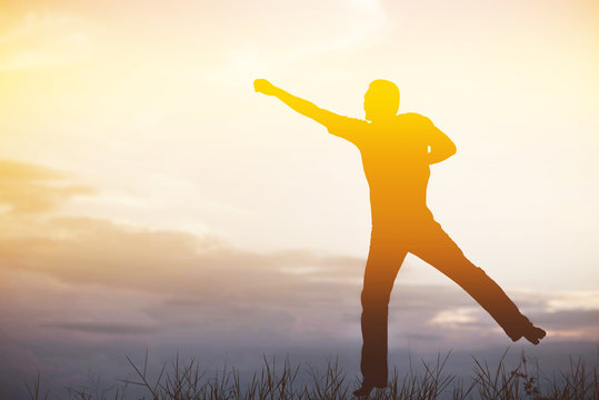 Happy man jumping, blue sky on background