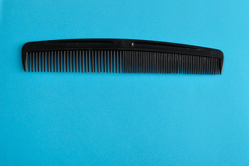 Comb isolated on a blue background