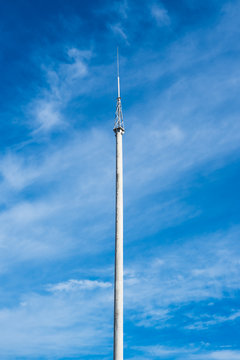 Lightning rod on the concrete column against the blue sky 