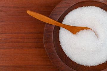 Magnesium sulfate in a wooden bowl with wooden spoon