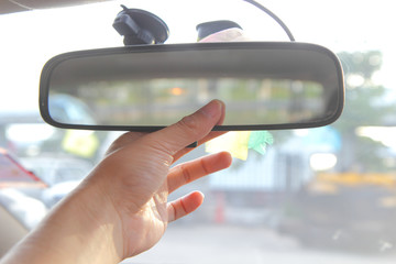 adjust rear view mirror