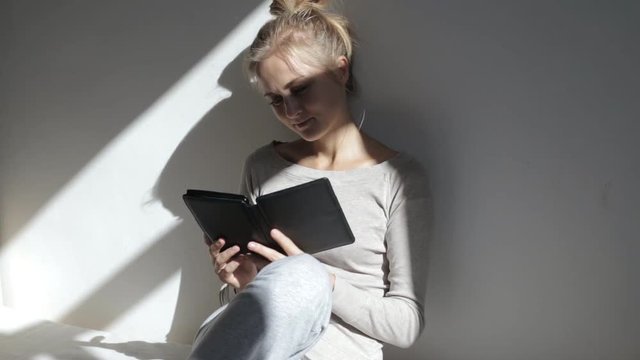 Beautiful woman with e-reader