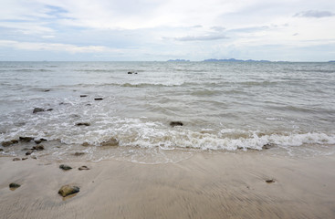 Rock beach with cloudy sky in Jum island, Krabi