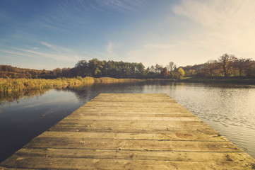 Fototapeta premium Lake in autumn, colorful robes, yellowed, colorful leaves on tre