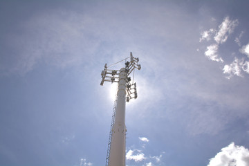 Obraz premium Mobile phone tower. Mobile phone network. Cell site or cell tower, cellular telephone site, electronic communications equipment, radio mast, cellular network digital signal processors.