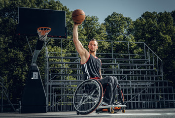 Cripple basketball player in wheelchair plays basketball.