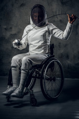 Paralympic female fencer in wheelchair.