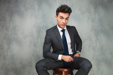 attractive seated young business man