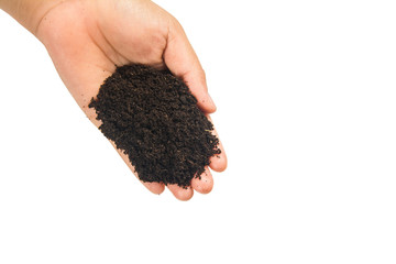 soil in hands on white background.