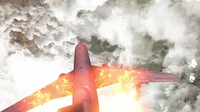 Passenger plane burning penetrates the clouds over the mountainous land