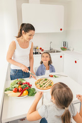 Mother and daughters eating healthy food