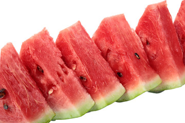 diagonal row of bright red watermelon slices. isolated on white background