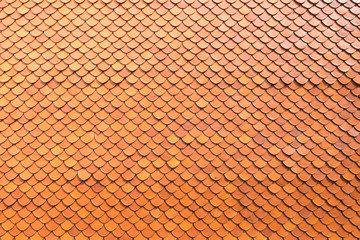 surface of bright red or orange tile roof in the temple or measure, abstract background texture