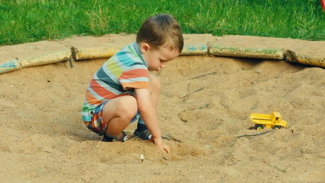 A child playing in the sandbox