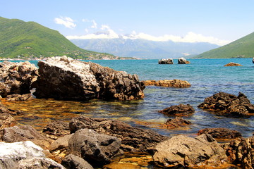 Beach with beautiful picturesque rocks in the sea and mountains in the distance Herceg Novi,  Montenegro, Bay of  Kotor.