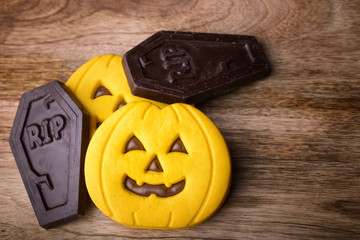 shaped cookie Halloween pumpkin and chocolate graves