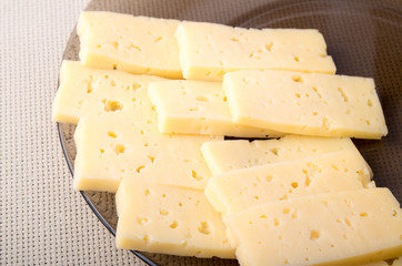 Group slices dry hard yellow cheese