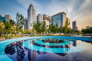 Fototapeta na wymiar Pool and modern skyscrapers at Banqiao, in New Taipei City, Taiw