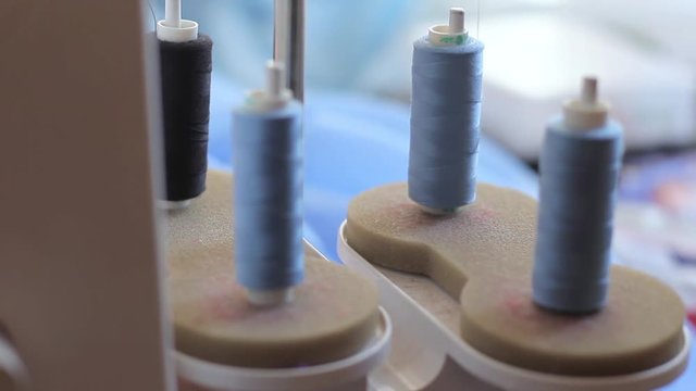 overlock work. unwinding thread. skeins of thread closeup