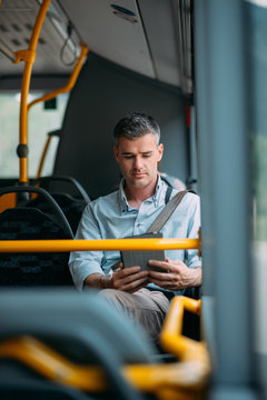 Businessman traveling by bus