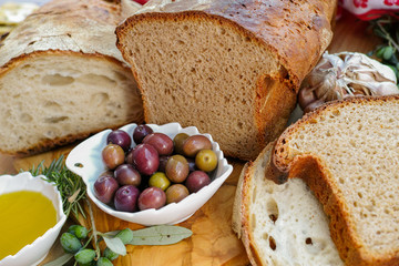 Traditional italian appetizer - fresh homemade bread, extra virgin olive oil