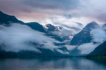 Mountains and lake in mist in the morning, Norway