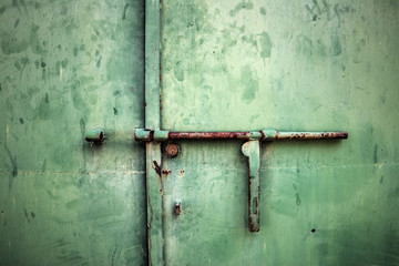  rusty metal deadbolt close up