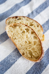 freshly baked homemade whole wheat grain buns on tablecloth, whole wheat bread