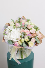 still life. White background, glass vase with Mixed bouquet. beautiful flowers