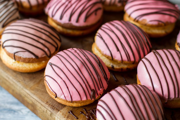 Glazed cookie sandwiches. Biscuits with decoration. New dessert in cafe menu. Bush cakes with cream filling.